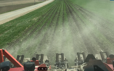 strip till machine pulled through a field planted to cover crops