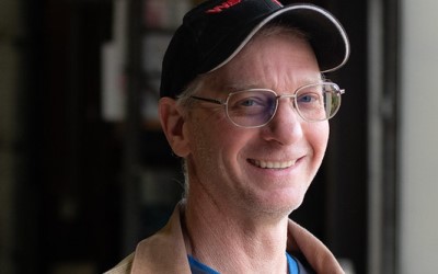 photo of farmer smiling at the camera